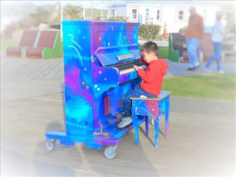 Street Performer - This piano is out in the square for anyone to play. I happened to be walking past and here was this wee boy playing his own tune. Had to capture the moment.